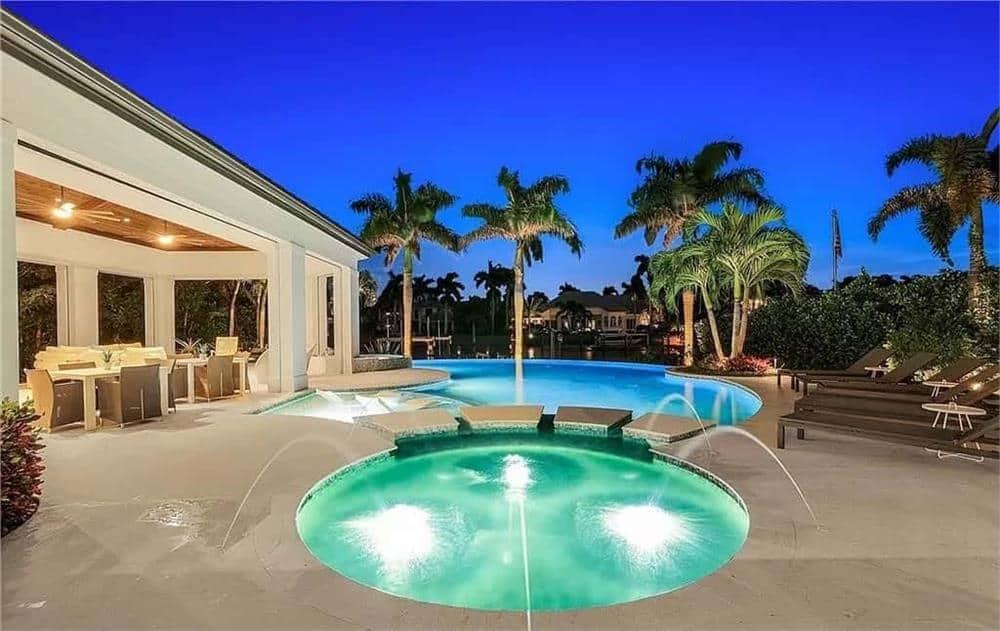 Relax in This Inviting Pool Area With Water Features