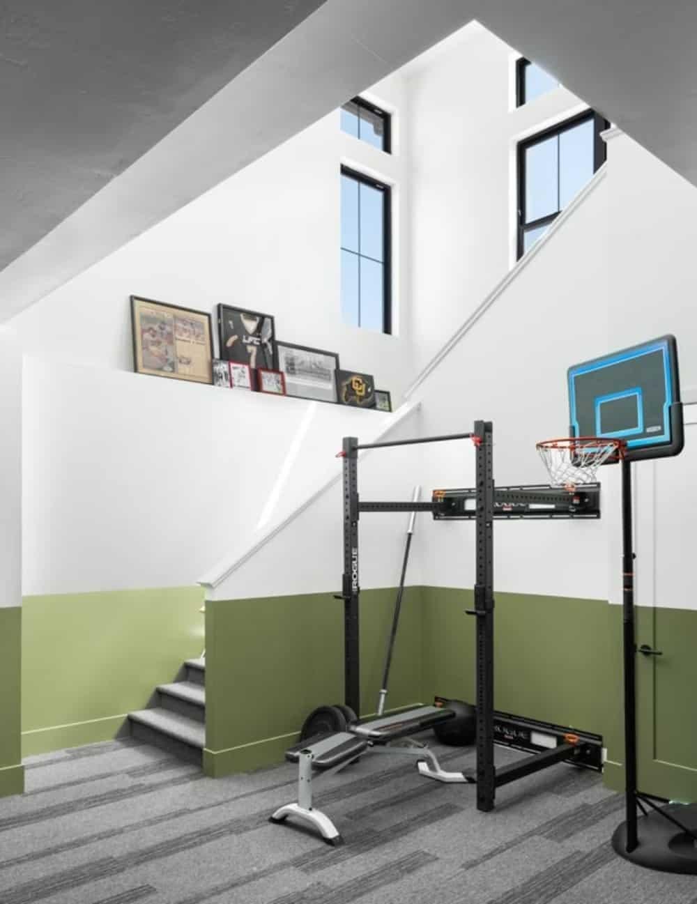 Unique Home Gym Corner with High Ceilings and Display Ledge