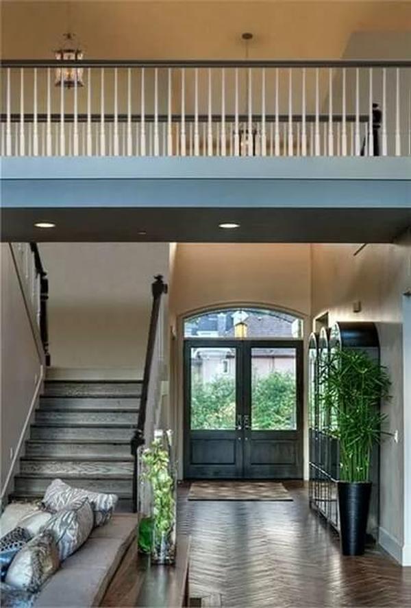Grand Entryway with Double Doors and Soaring Ceilings
