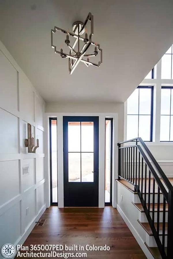Check Out the Modern Geometric Chandelier in This Entryway