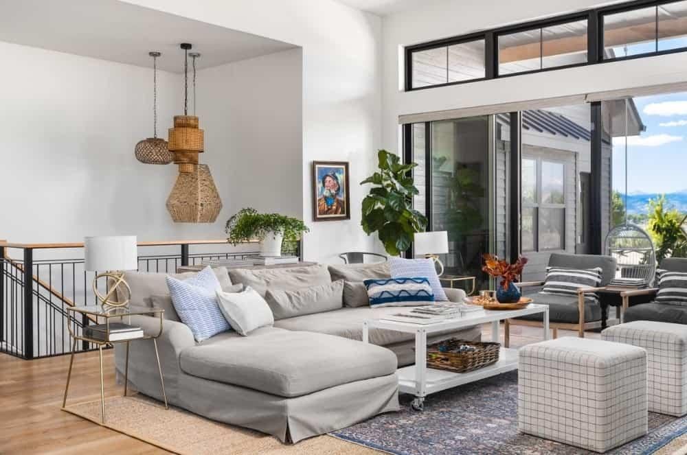 Relax in This Living Room with Basket Pendant Lights and Outdoor Views