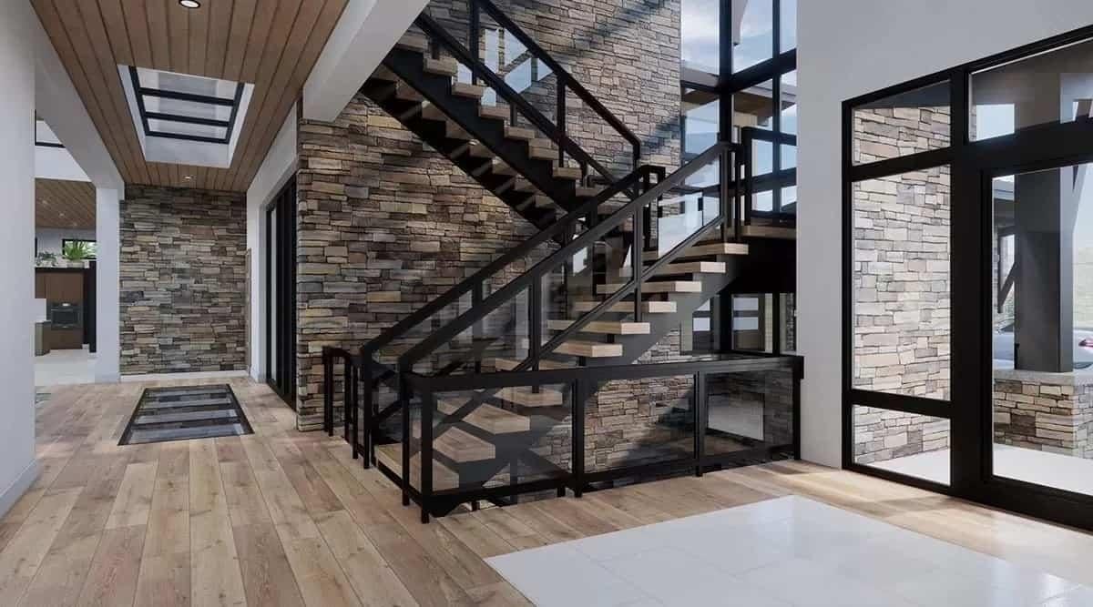 Wow, Look at This Striking Stairwell with Bold Stone Walls