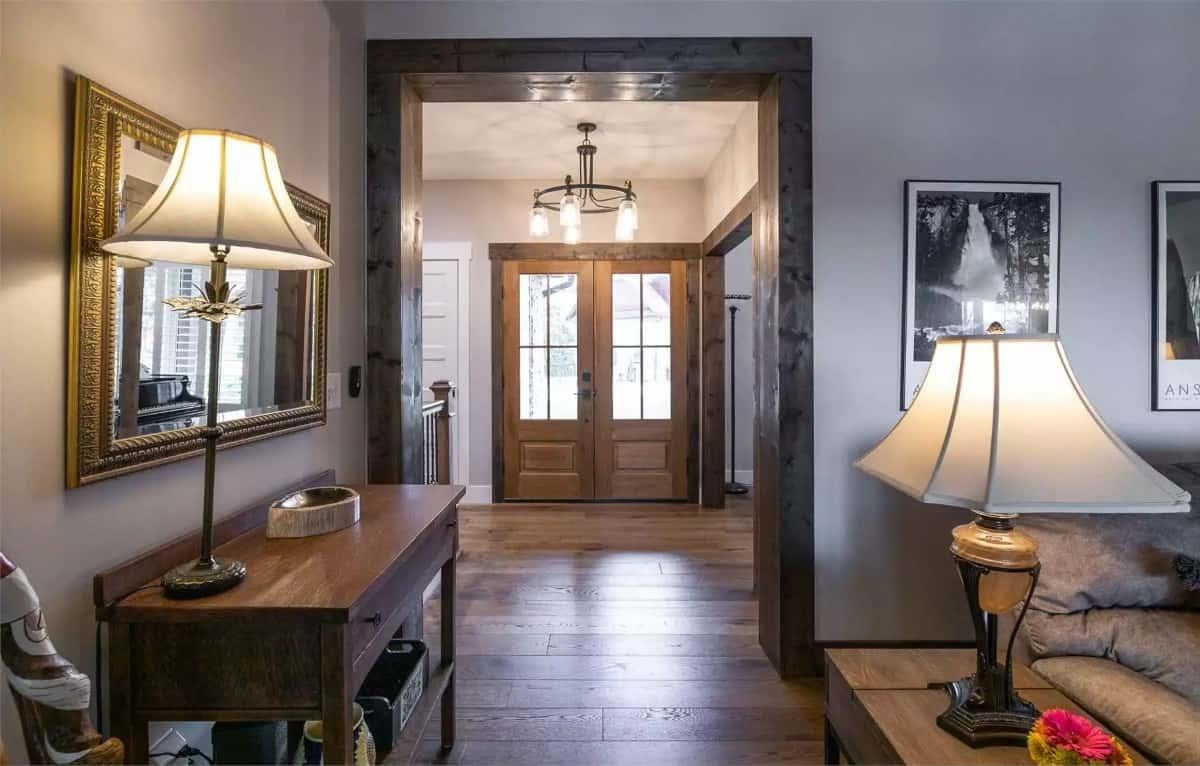 Warm Entryway with Rich Wooden Trim and Inviting Lighting