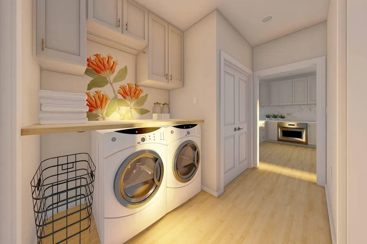 Bright Laundry Room with Vibrant Floral Accent and Modern Appliances