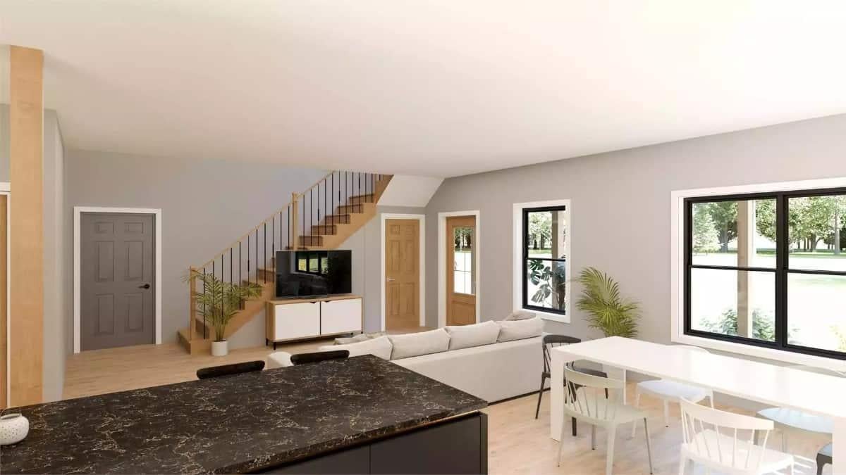 Open Living Space with a Striking Metal Railing and Cozy Seating