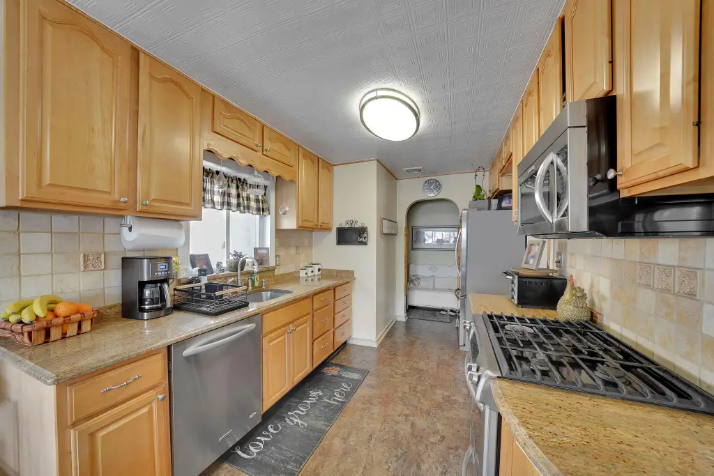 Colonial 3-Bedroom Home with Finished Basement and Detached Garage (1,920 Sq. Ft. Floor Plan)