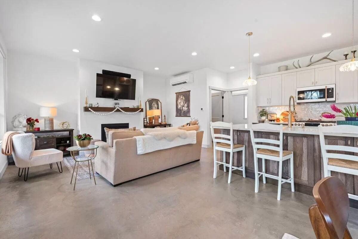 Open Living Area Featuring a Functional Kitchen Island