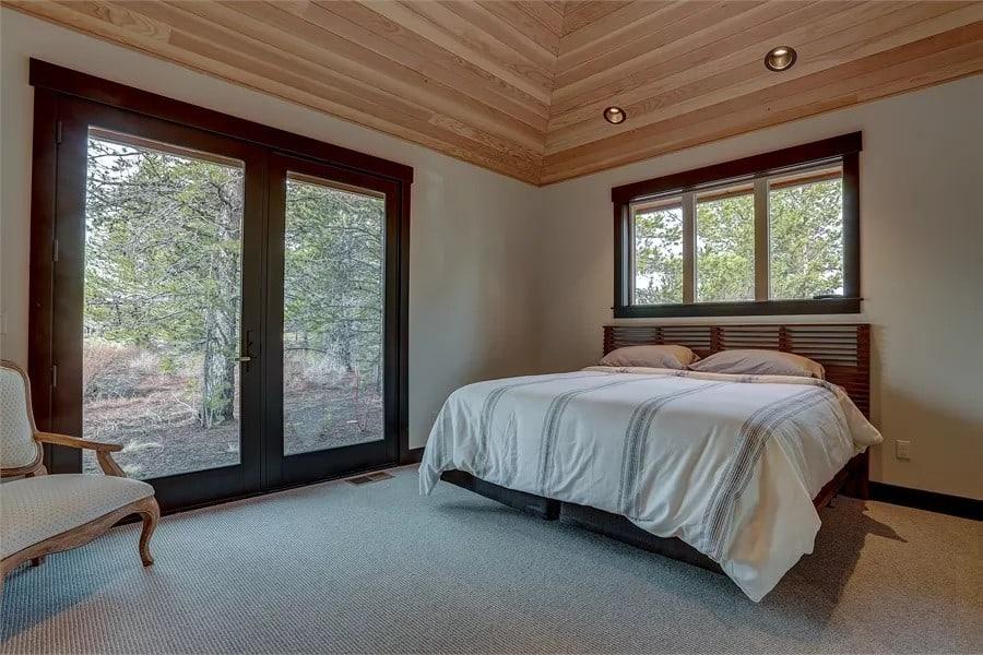 Tranquil Bedroom with Expansive French Doors Leading Outside