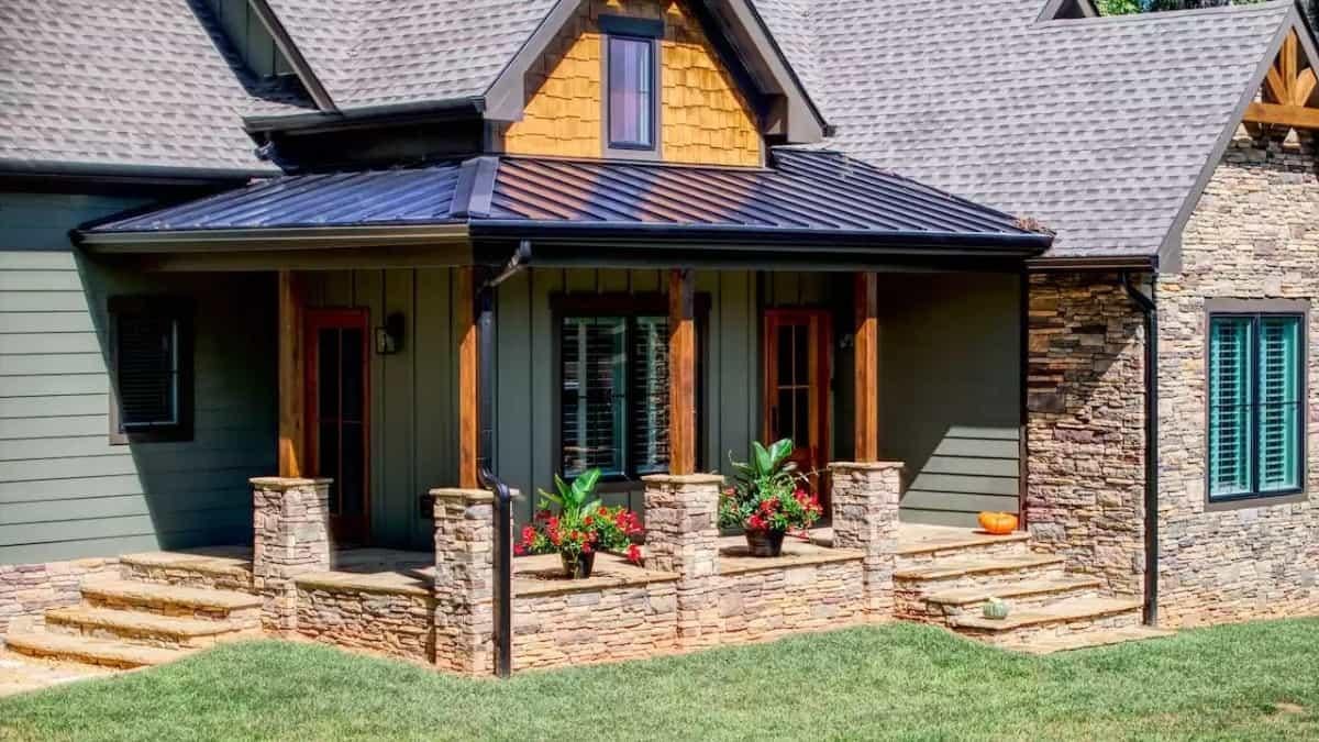 Charming Front Porch with Bold Stone Columns and Metal Roofing