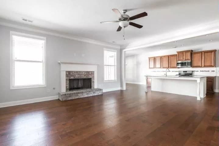 Classic Living Room Featuring a Stately Brick Fireplace