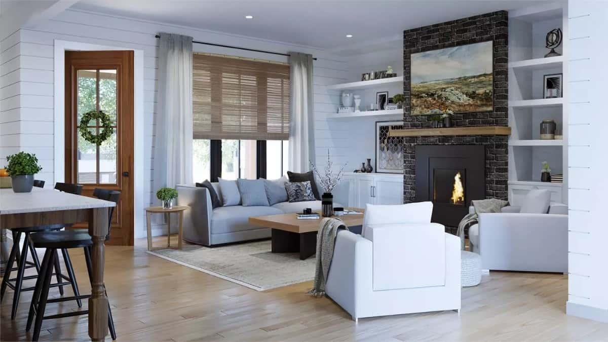 Check Out the Sleek Brick Fireplace and Shiplap Walls in This Living Room