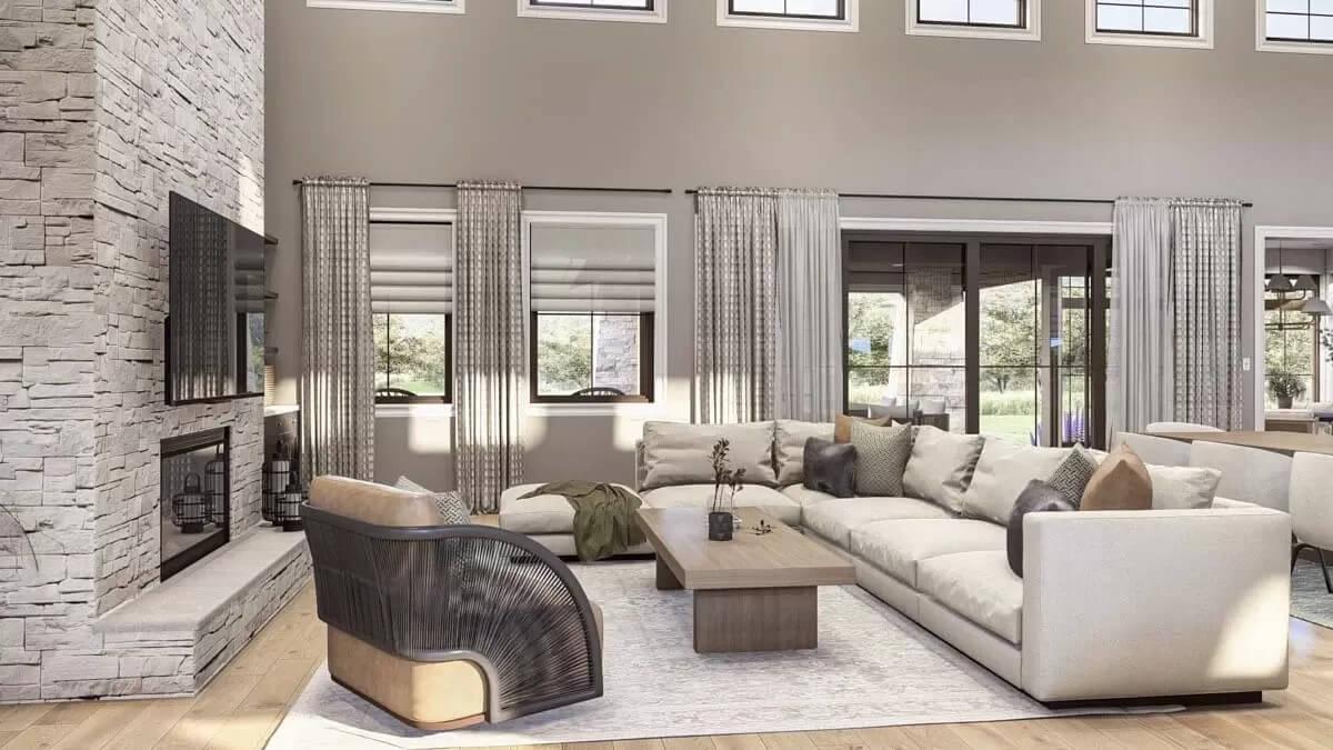 Spacious Living Room with a Striking Stone Fireplace and Ample Windows
