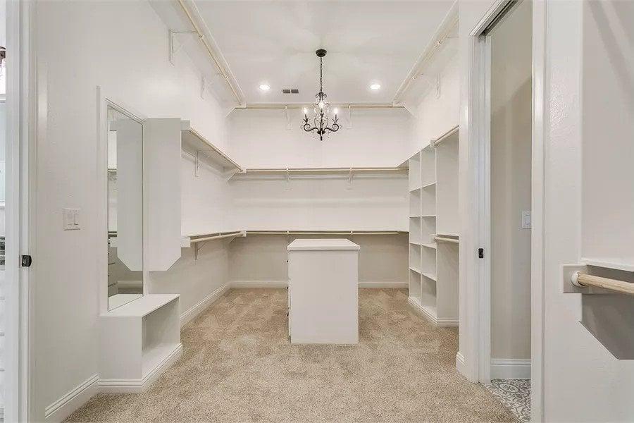Step Inside This Expansive Walk-In Closet with Elegant Chandelier
