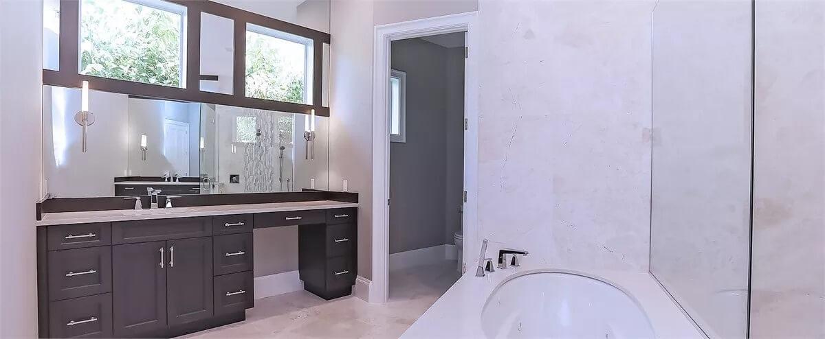 Sleek Bathroom Design with a Floating Vanity and Modern Sconces
