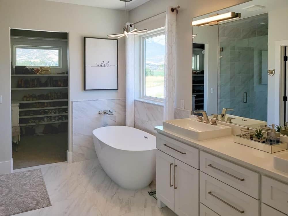 Notice the Freestanding Tub and Sleek Dual Sinks in This Modern Bath