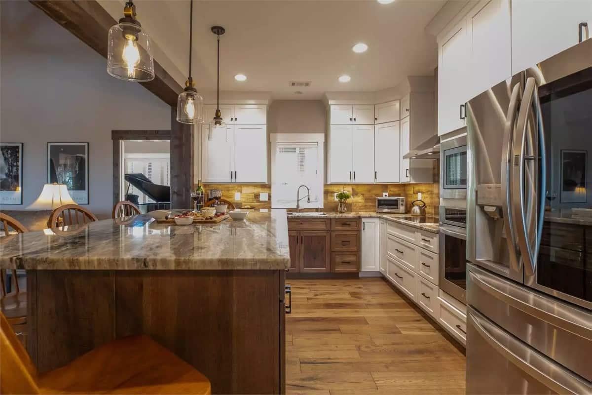 Check Out the Wooden Island and Pendant Lighting in This Craftsman Kitchen