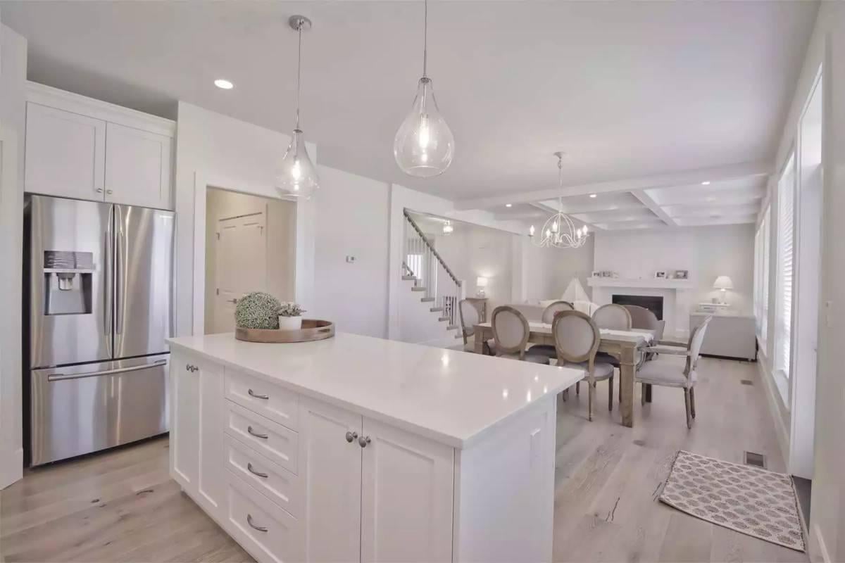 Seamless Flow from this Bright Kitchen to the Cozy Living Area