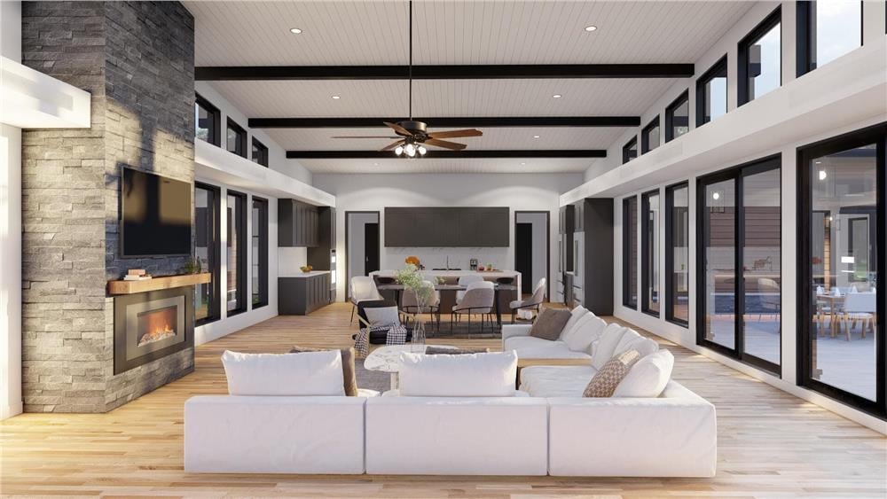 Stone Fireplace Anchors This Light-Filled Open Living Space