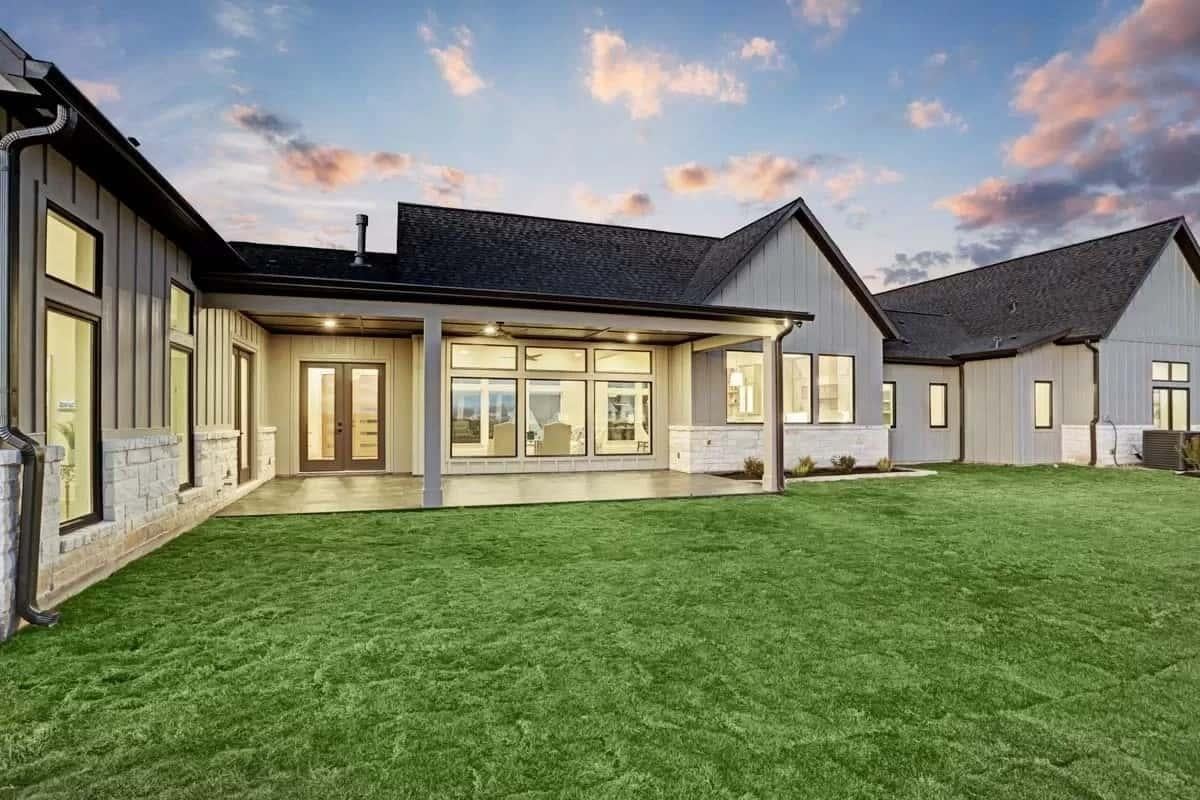 Rear Patio with Striking Vertical Siding and Expansive Glass Doors