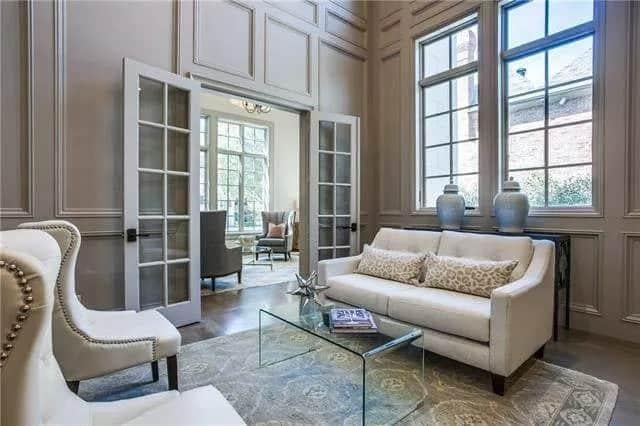 Refined Sitting Room with Elegant Paneling and Ample Light