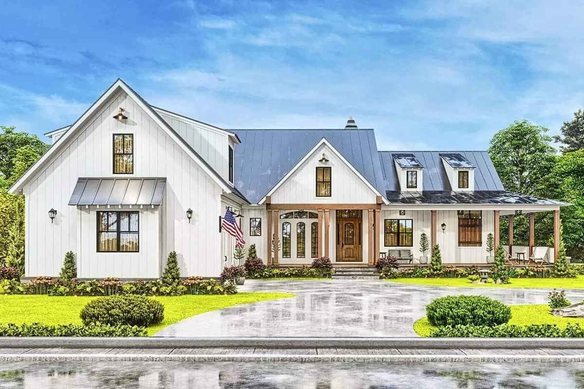 Admire the Charming Dormers and Inviting Front Porch on This Farmhouse