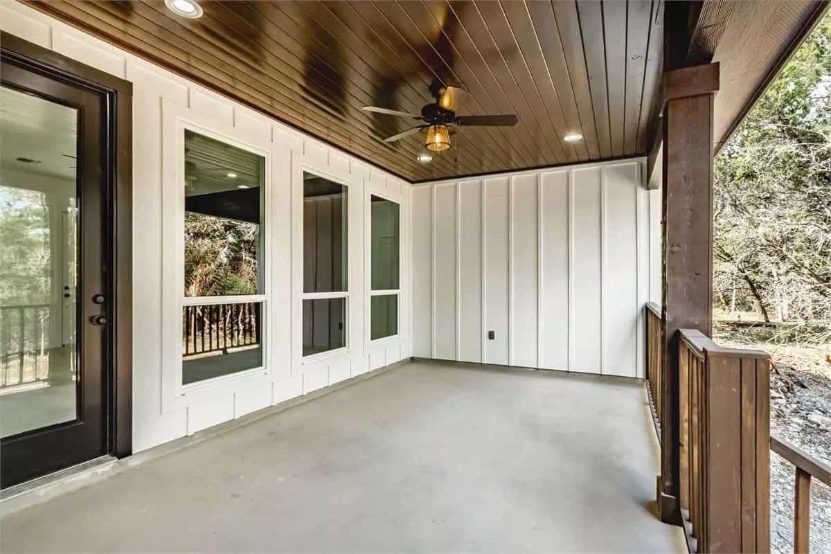 Explore the Covered Porch with Stylish Board and Batten Siding