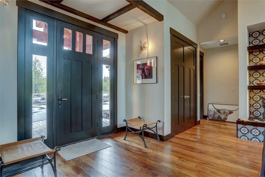Craftsman Entryway with Bold Doors and Elegant Stair Detailing