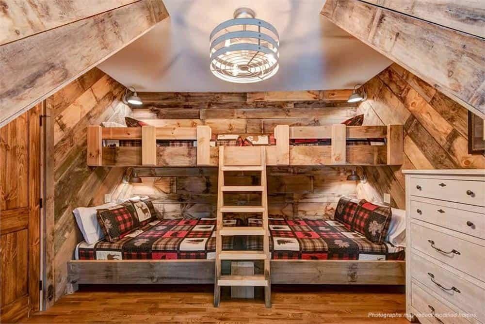 Charming Bunk Room with Rustic Wood Paneling and Plaid Accents