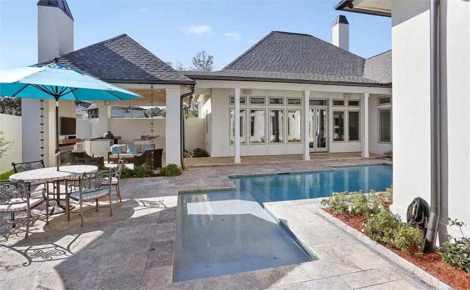 Relax by the Pool Under the Bright Umbrella in This Chic Outdoor Space