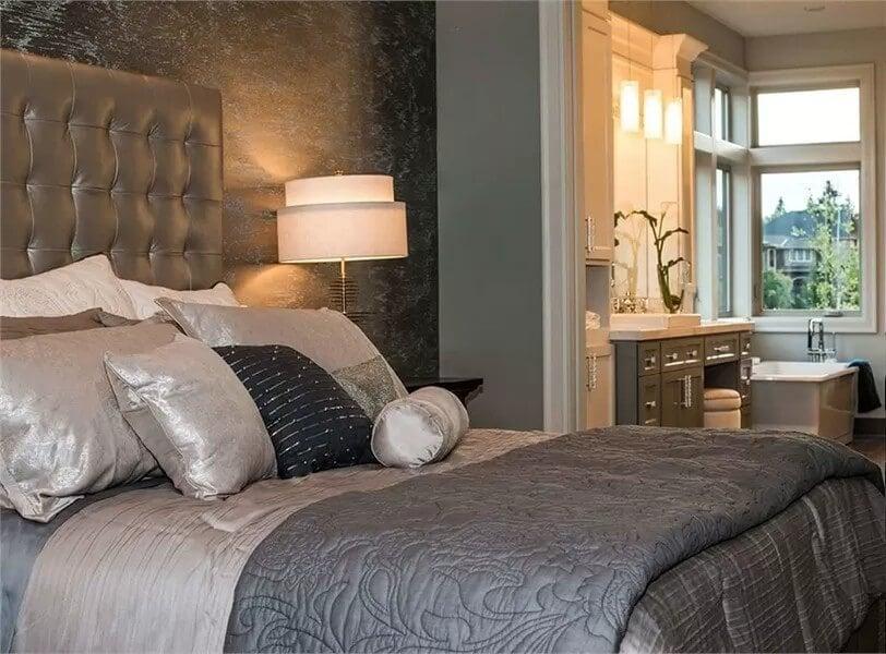 Sophisticated Bedroom with a Tufted Headboard and En Suite Bath