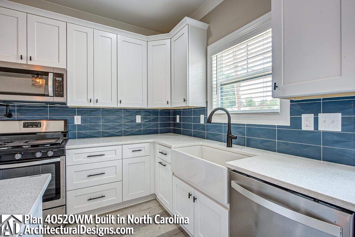 Check Out This Farmhouse Sink Against a Bold Blue Backsplash