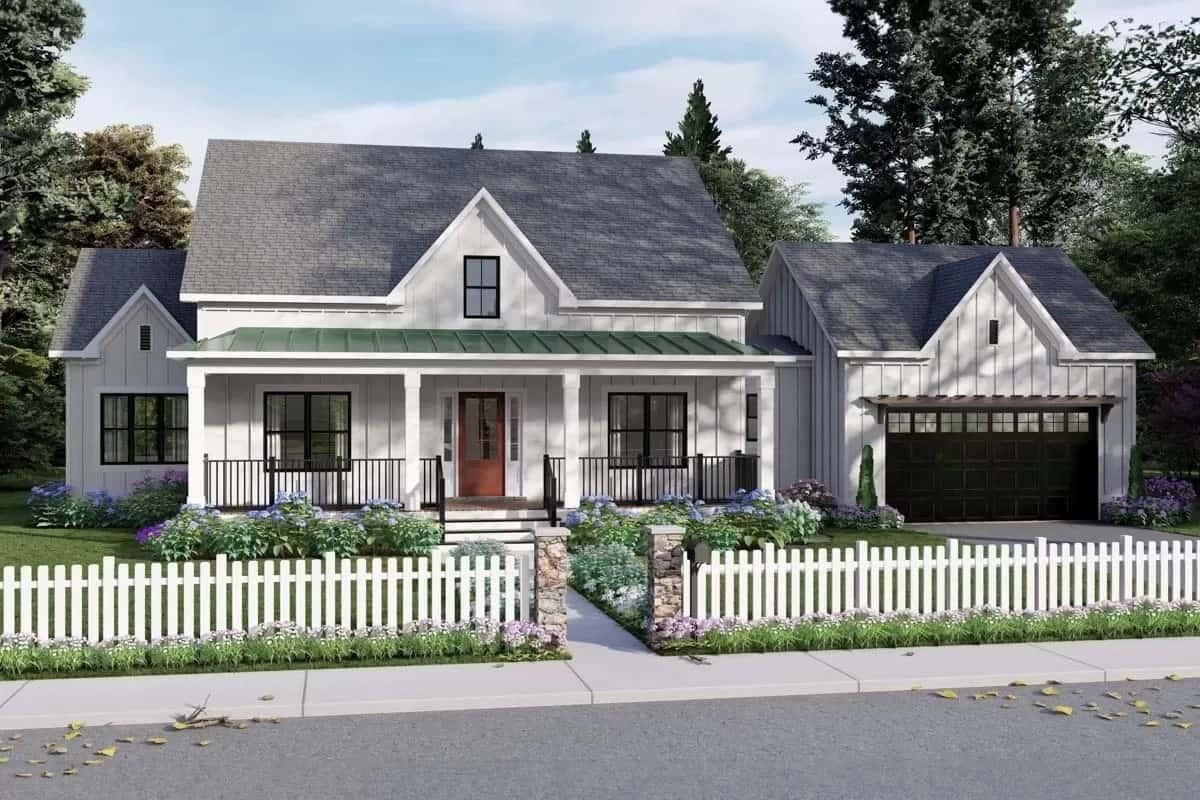 Classic Farmhouse with a Green-Topped Porch and Inviting Facade