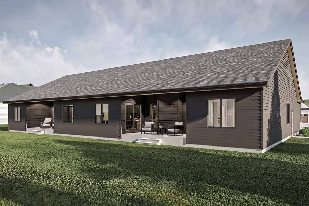 Simple Backyard Retreat with Dark Siding and Patio Seating