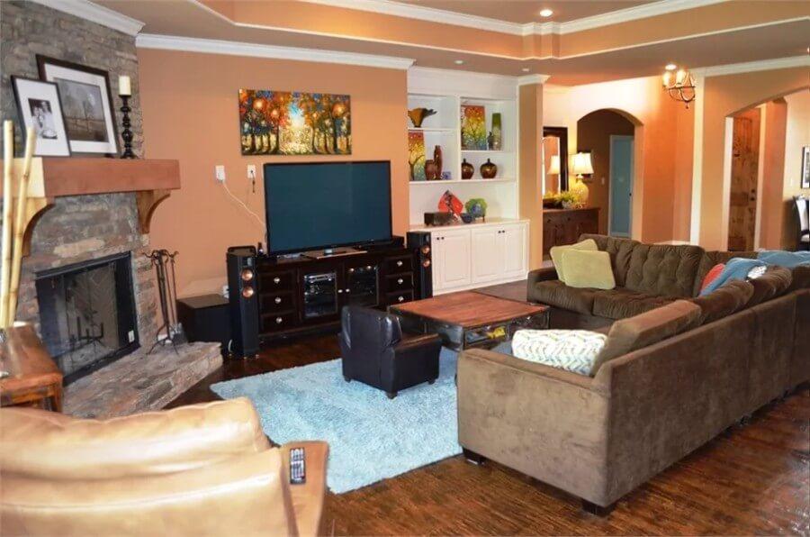 Living Room with Rustic Stone Fireplace and Colorful Accents