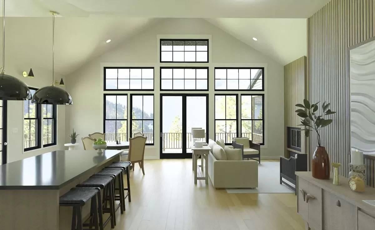 Take in the Stunning Wall of Windows in This Airy Living Area