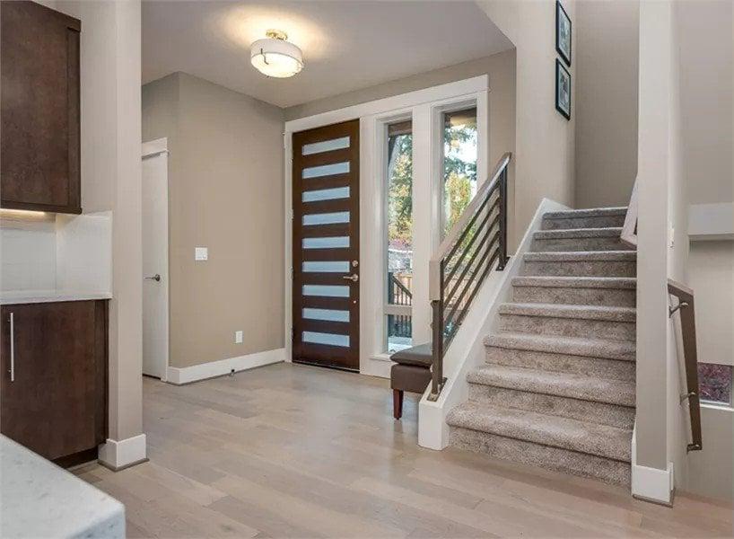 Modern Entryway with Horizontal Glass Accented Door