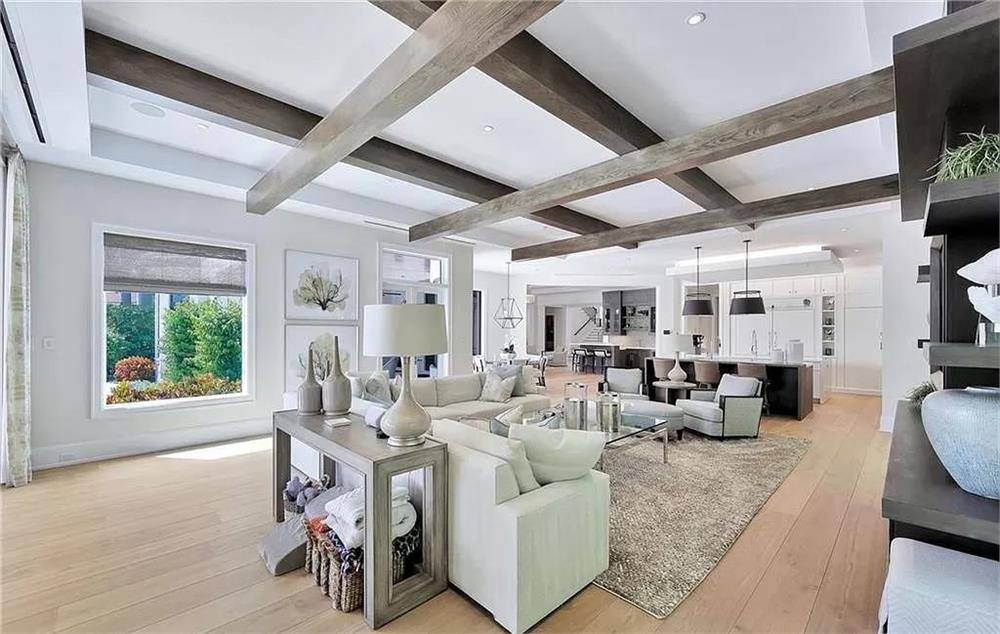 Explore This Living Room With Charming Exposed Beams and Soothing Palette