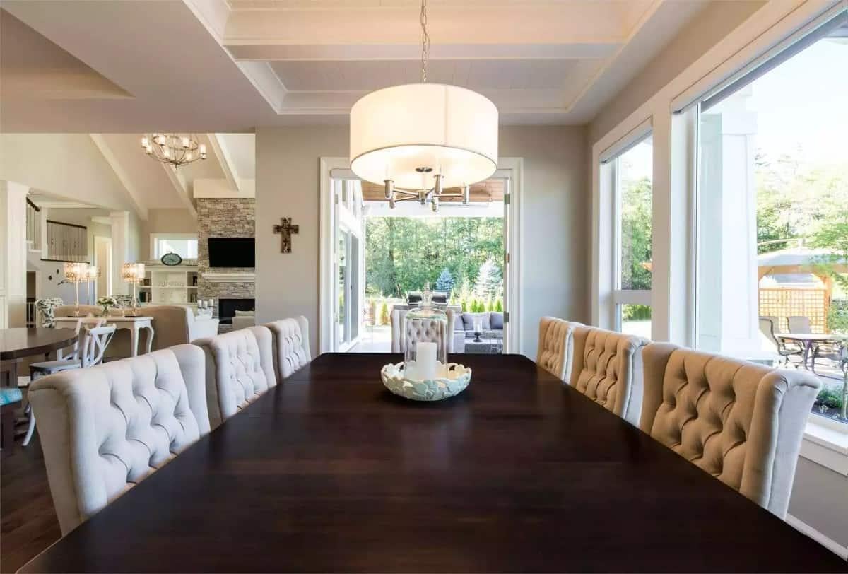 Admire the Tufted Chairs and Views in This Dining Space