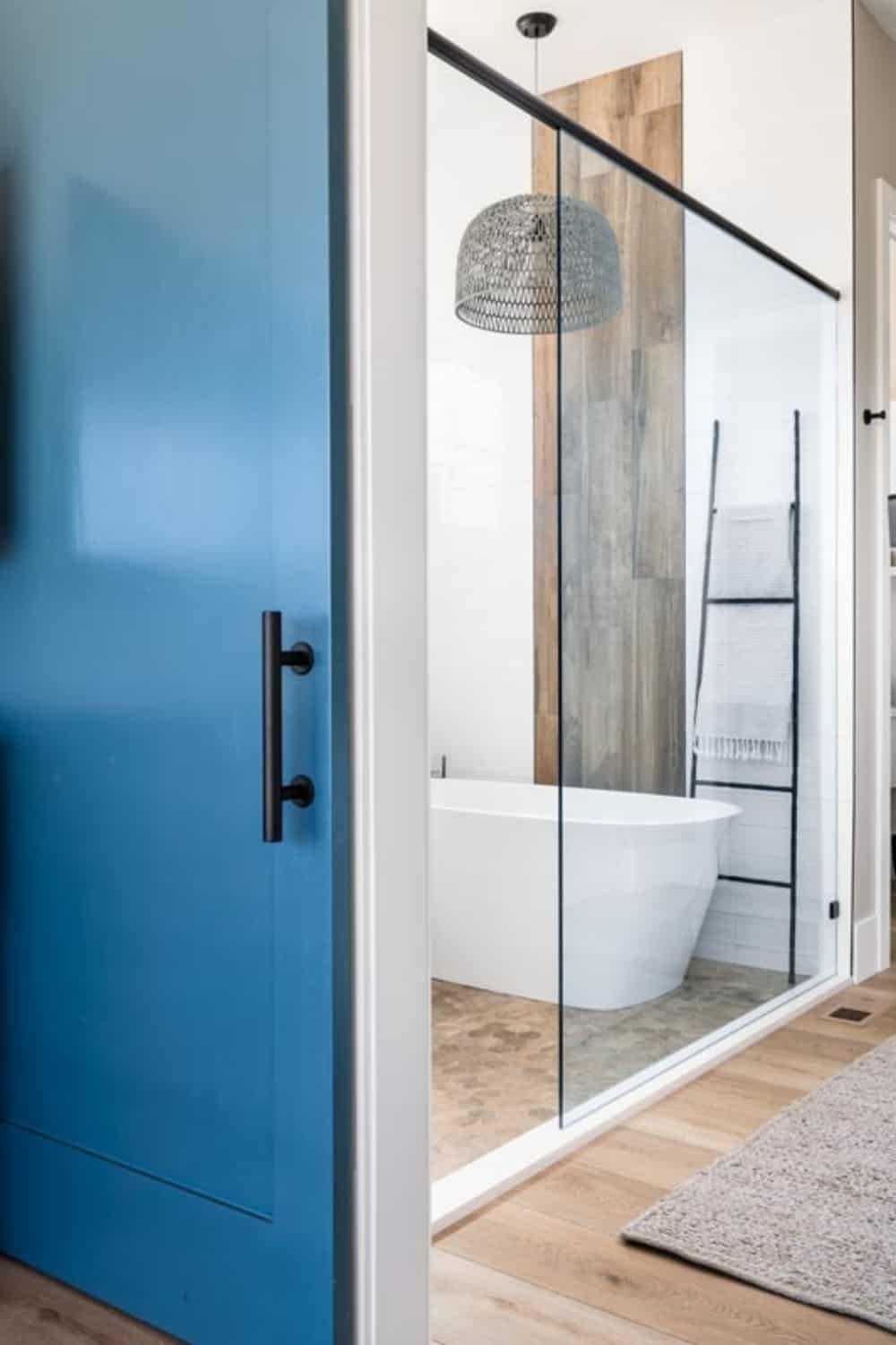 Notice the Bold Blue Door Open to This Spa-Like Bathroom
