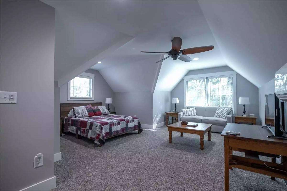 Cozy Loft Space with a Charming Patchwork Quilt