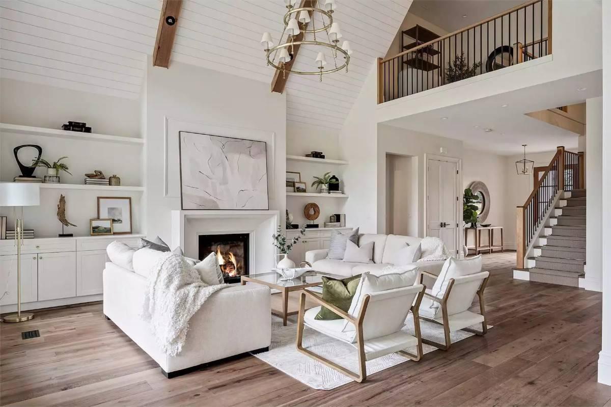 Look at That Vaulted Ceiling and Cozy Fireplace in This Bright Living Room
