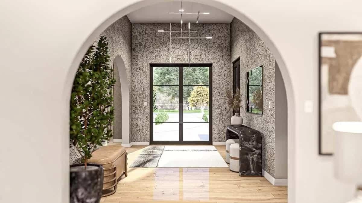 Feel the Sophistication with This Arched Entry and Artistic Wallpaper