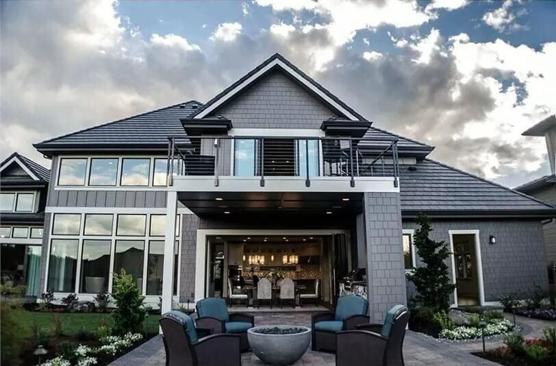 Elegant Outdoor Living Space with Striking Second Story Balcony