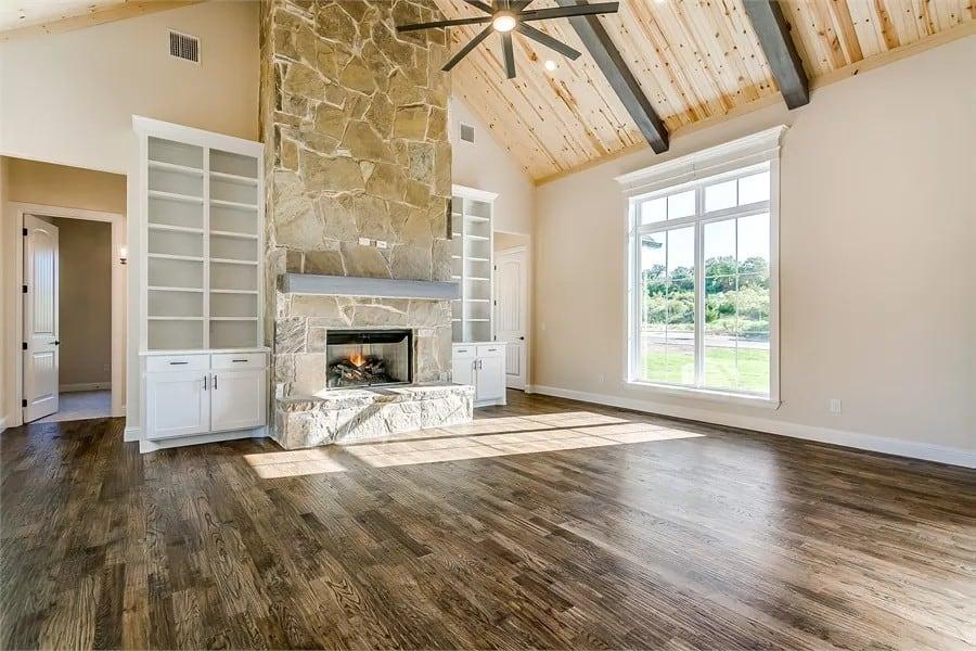 Notice the Stunning Stone Fireplace and Vaulted Ceiling Here