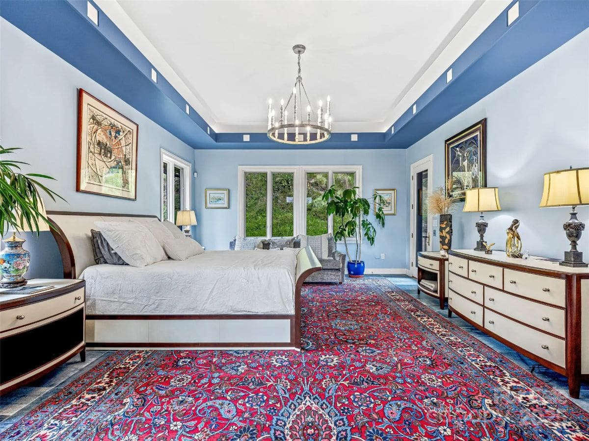 Bedroom contains a bed with light bedding and two nightstands.