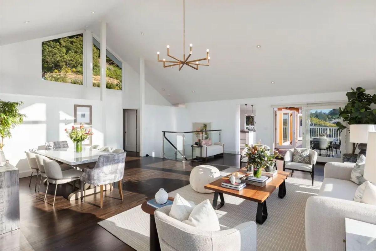 Airy and modern living space featuring a seamless flow between the dining and lounging areas. 