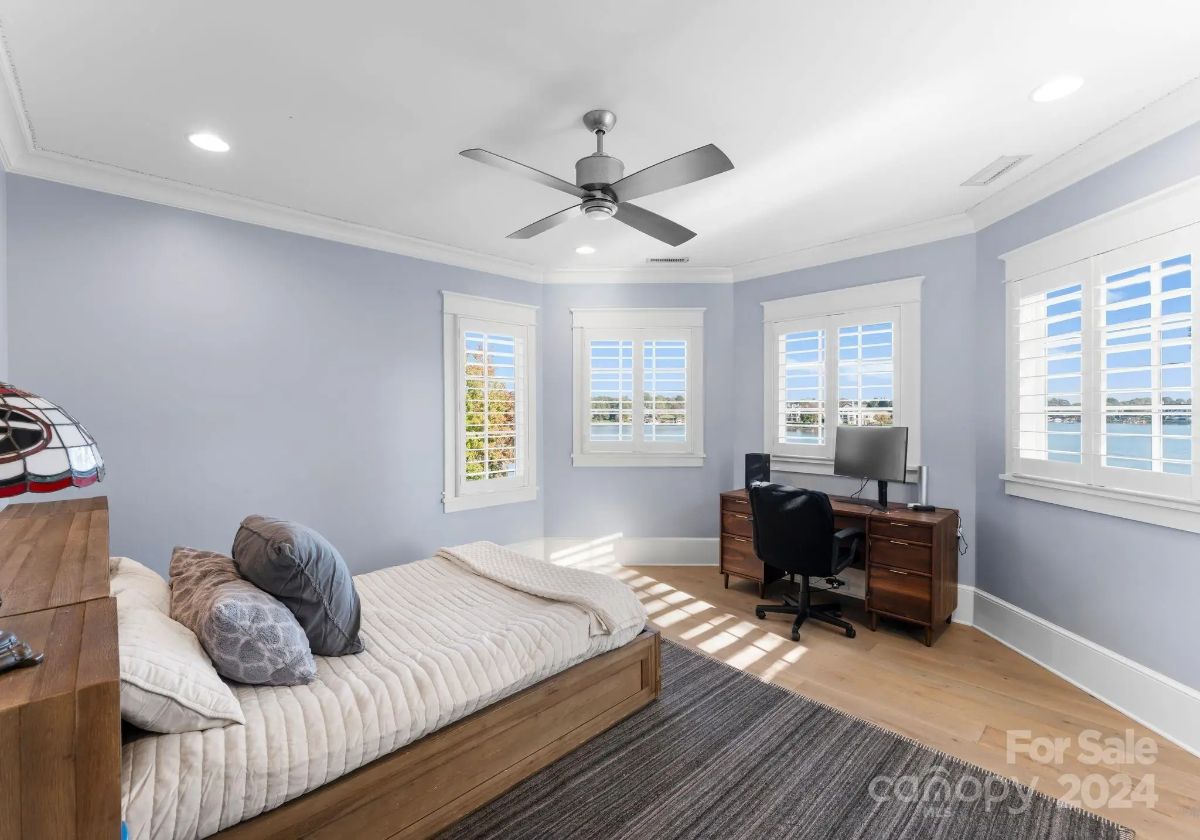 Secondary bedroom doubles as a study space, offering great natural light and clean design. 
