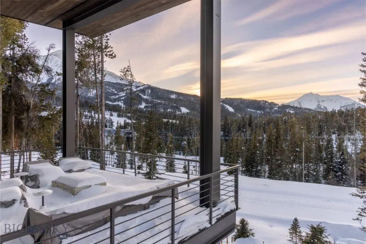 Tranquil outdoor terrace with plush seating, providing a perfect spot to enjoy a winter sunset.