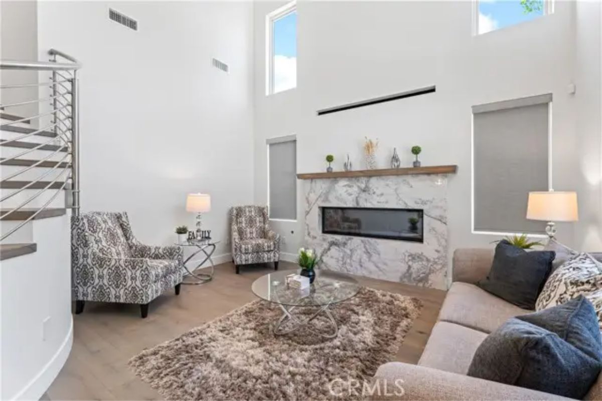 Open-concept space with tall ceilings and white walls.