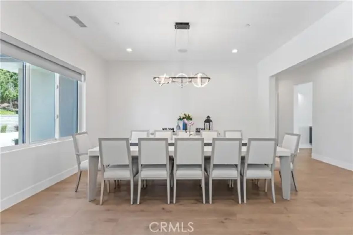 Long rectangular dining table with seating for twelve.